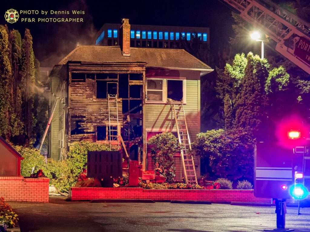 Halsey_Fire_house_firetruck_ladder_on_house