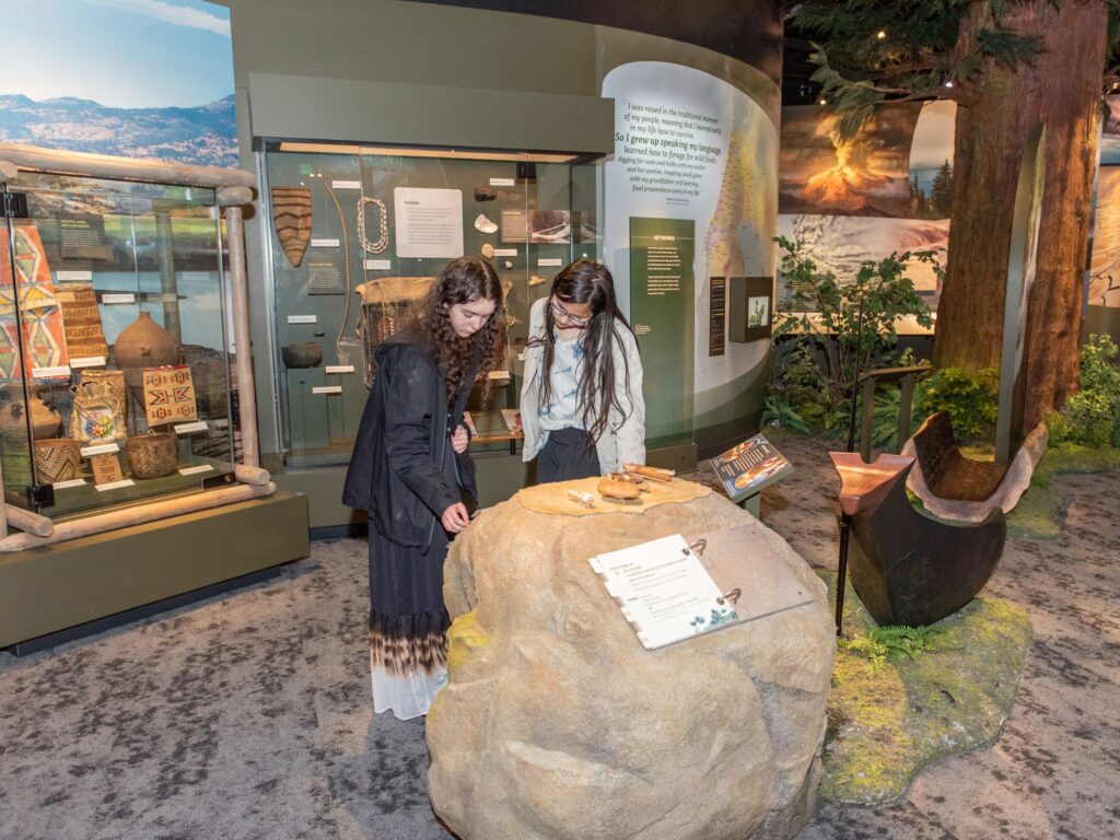 visitors at the experience oregon exhibit at the OHS