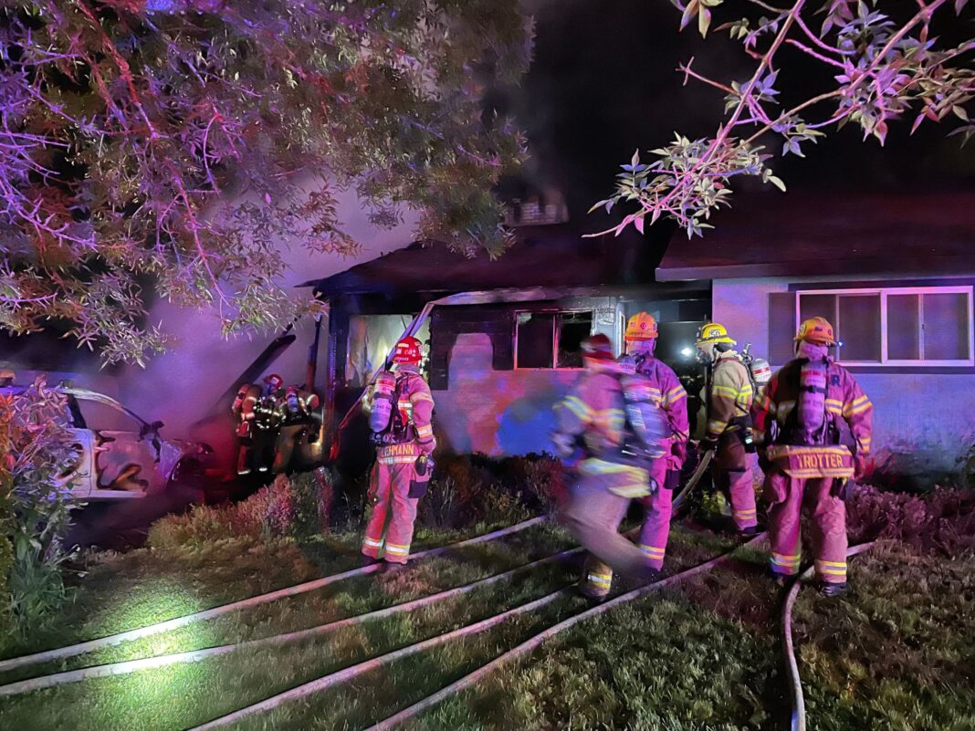 Firefighters working at the site of the fire