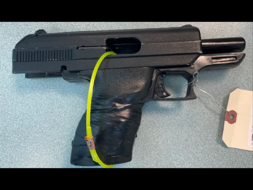 gun seized from the suspect while eluding
