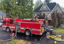 Eleven displaced as a result of two lithium ion battery fires firefighters outside of one of the homes that suffered from a battery fire